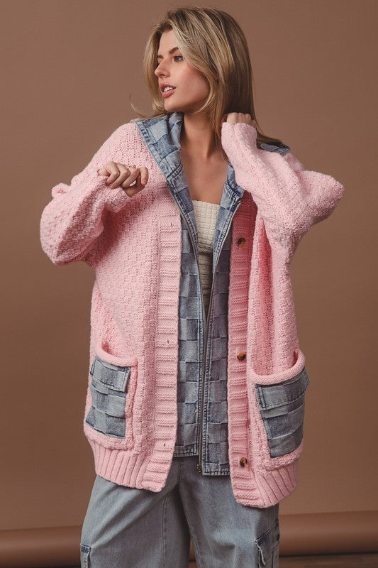 a woman in a pink sweater and jean jacket