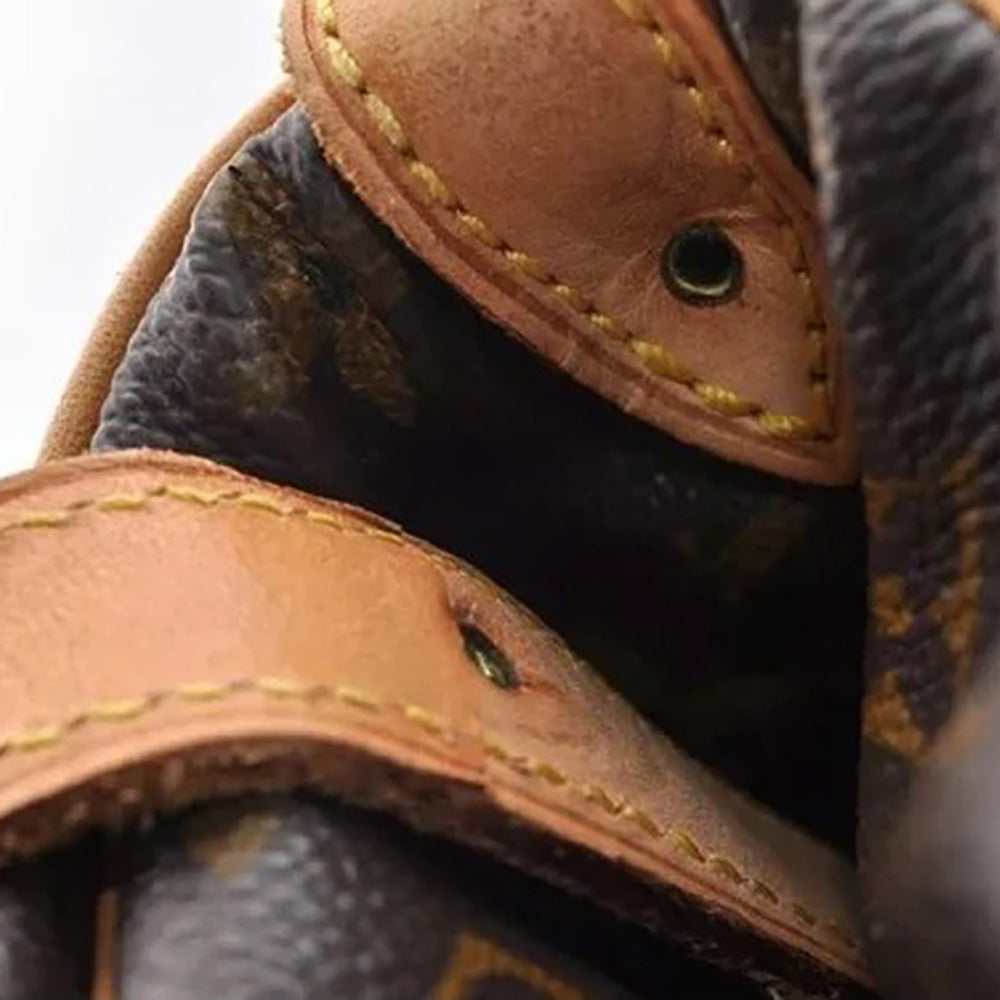 a close up of a pair of brown leather shoes