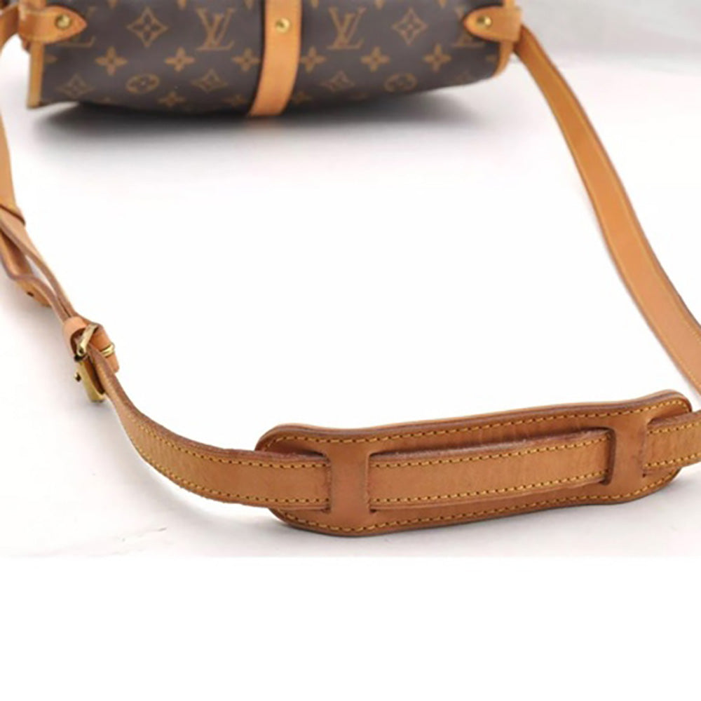 a brown louis vuitton bag on a white background