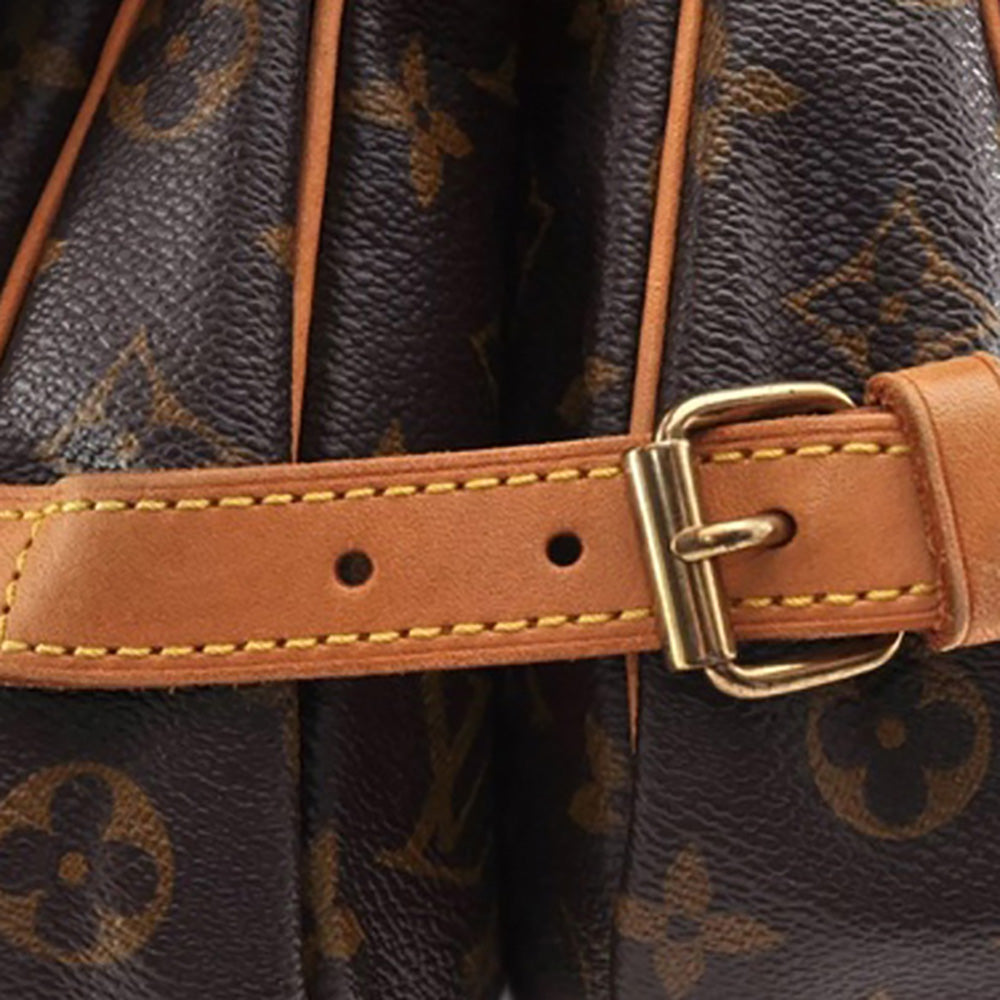 a close up of a brown and black purse