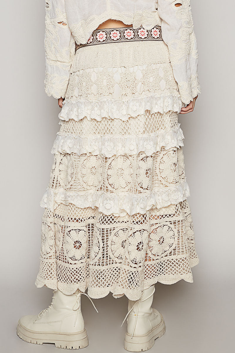 a woman in a white dress and boots