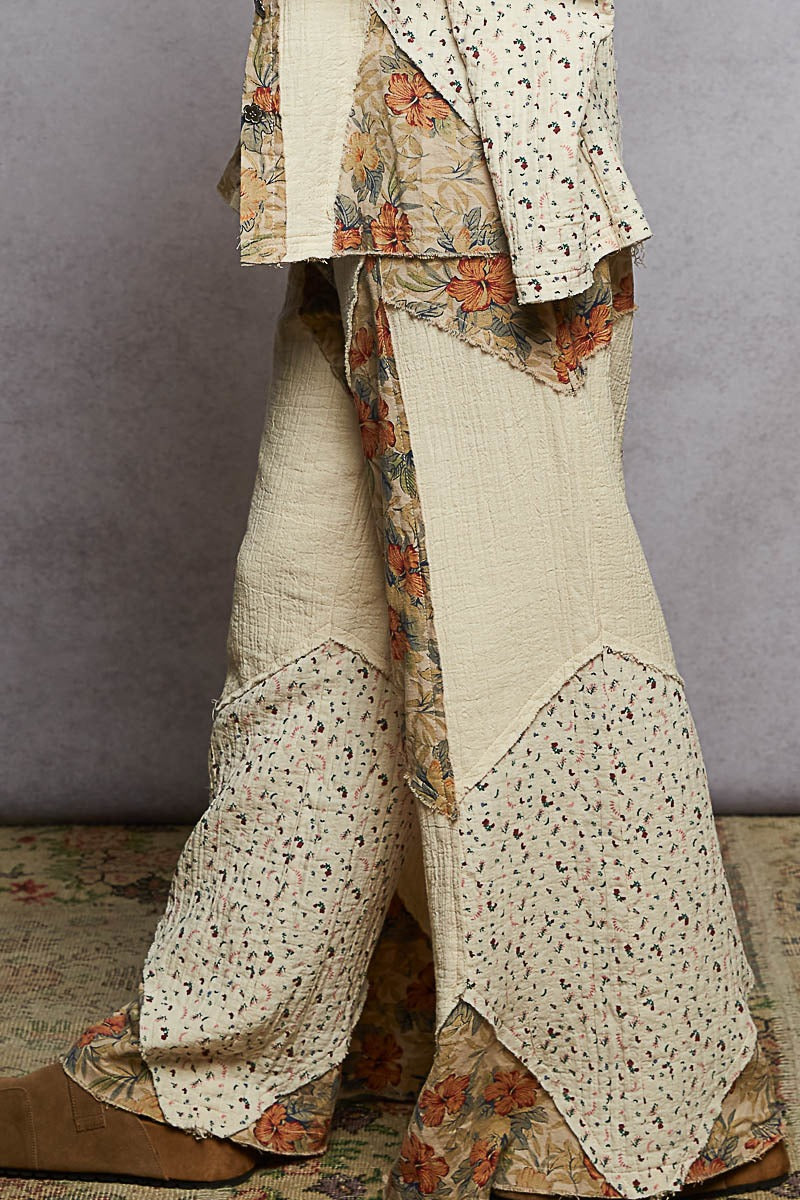 Traditional outfit with floral patterns on a plain background