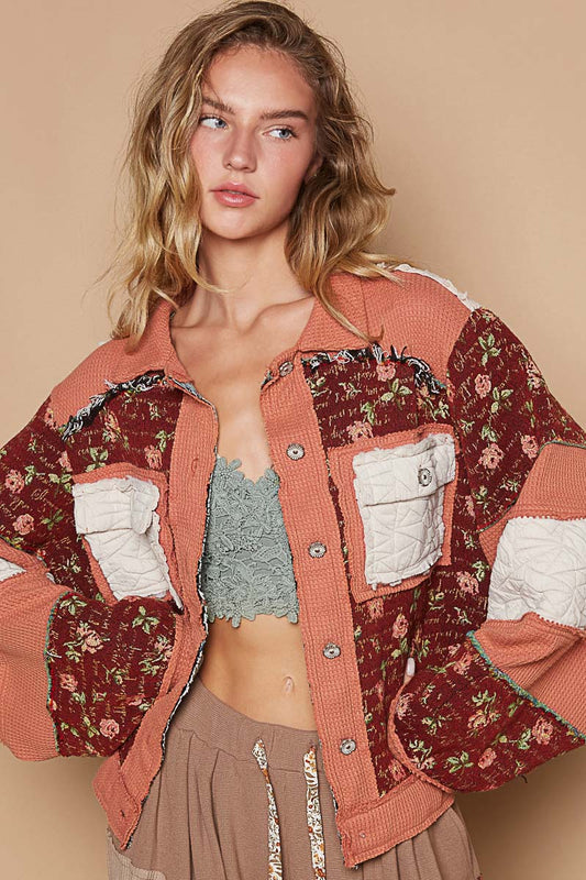 a woman wearing a crop top and a jacket