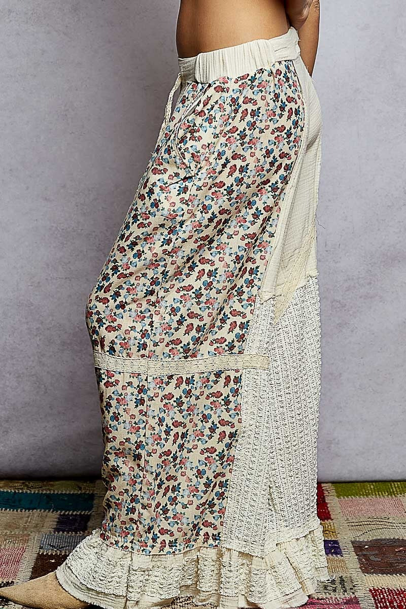 Floral patterned skirt with ruffled bottom on a plain background