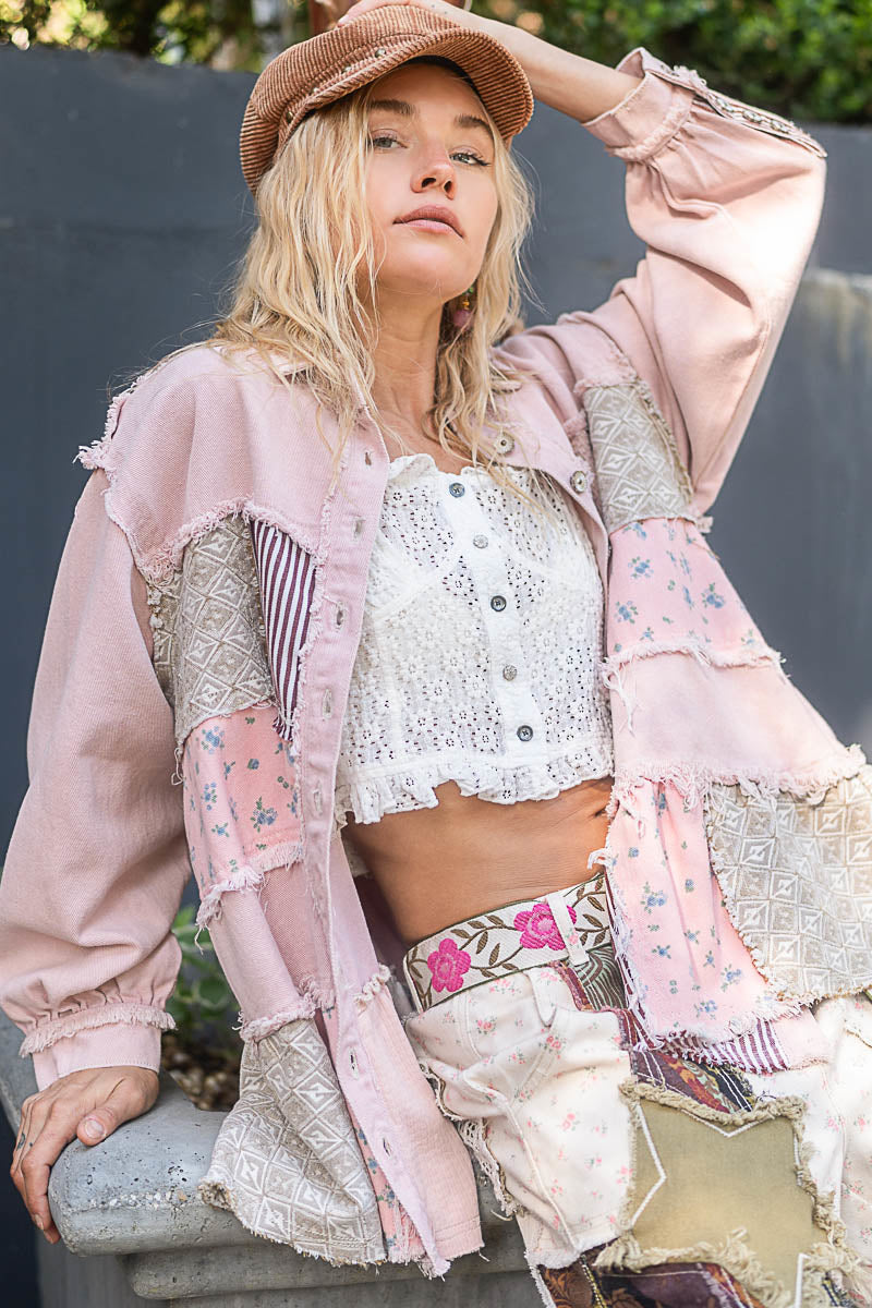 a woman wearing a pink jacket and hat