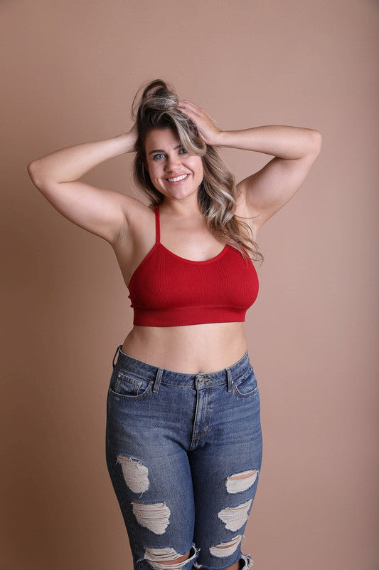 a woman in a red top is posing for a picture