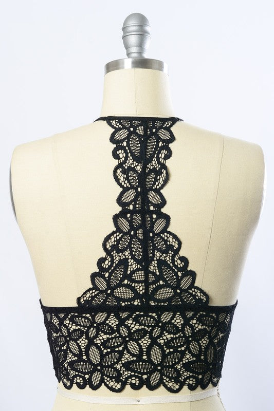 a mannequin with a black lace top on it
