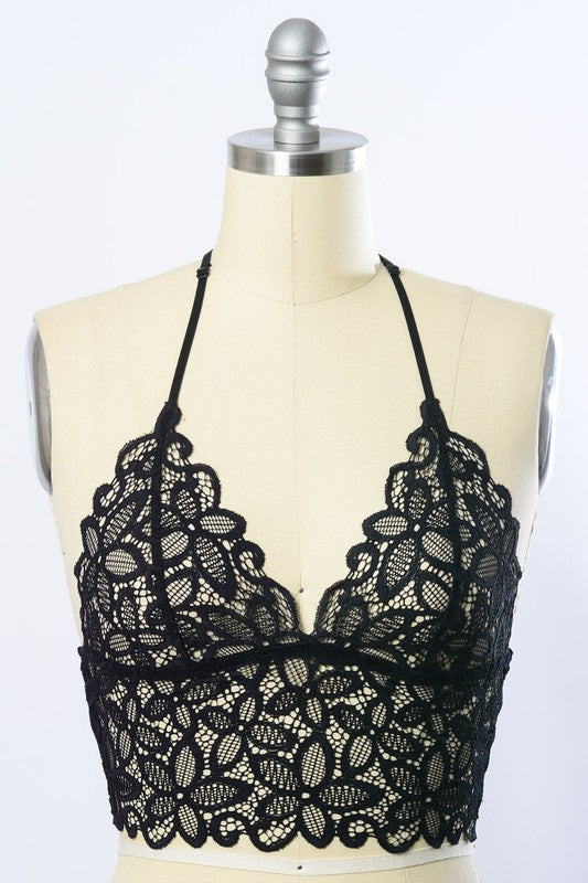 a mannequin wearing a black lacy bra