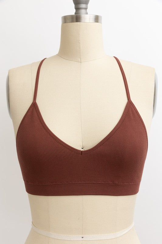 a female mannequin wearing a brown bra
