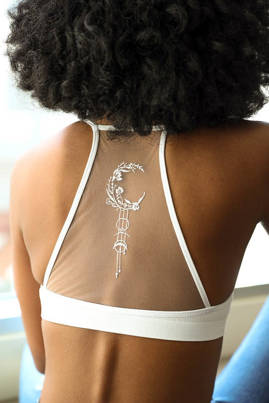 a woman with a tattoo on her back