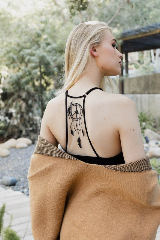 a woman with a tattoo on her back