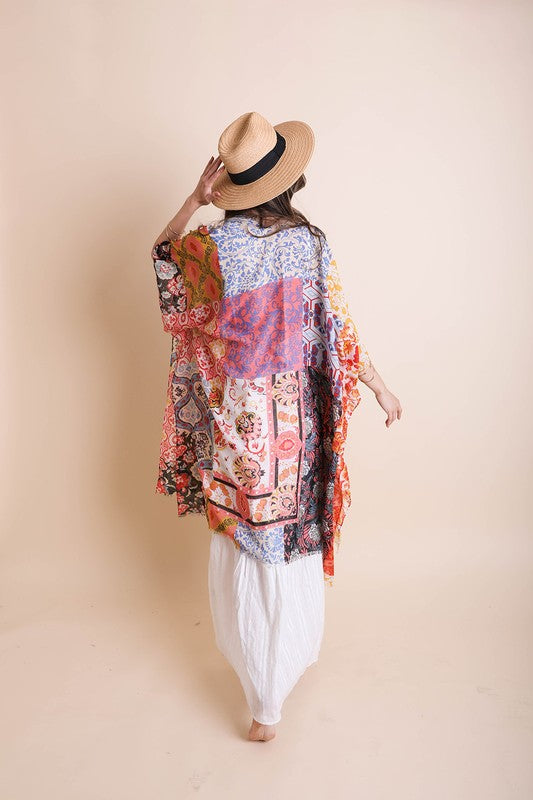a woman wearing a hat and a colorful shirt