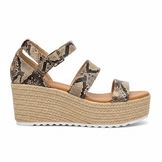 Side profile of snake print espadrille sandal showing jute platform wedge height