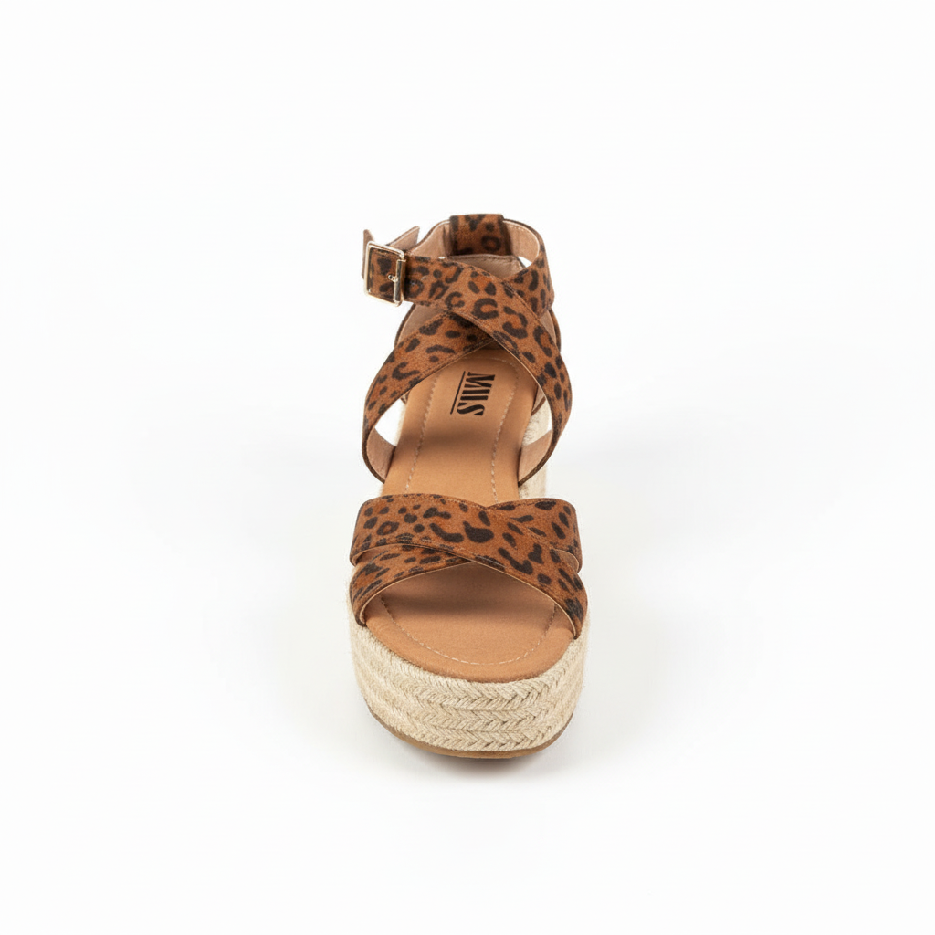 Women's leopard print espadrille platform sandal front view showing crisscross straps and braided jute sole on white background