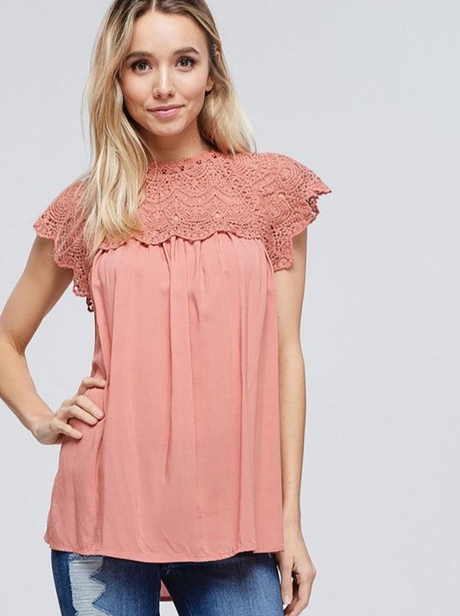 Say hello to this cutie - the Women's Lace Crochet Contrast Sleeveless Solid Top! It's the perfect addition to your wardrobe for days when you want something with a little personality.