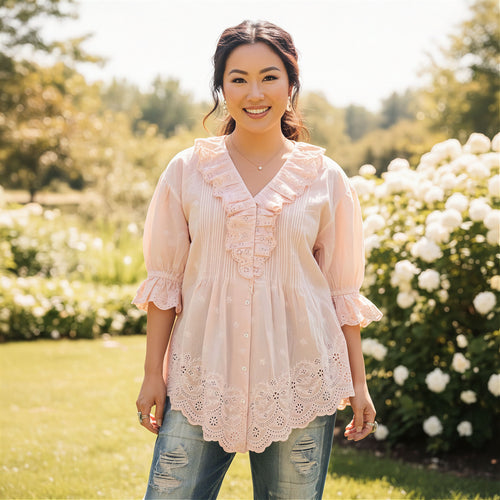 Women's blush pink eyelet ruffle blouse, cotton, relaxed peplum fit, styled with distressed denim