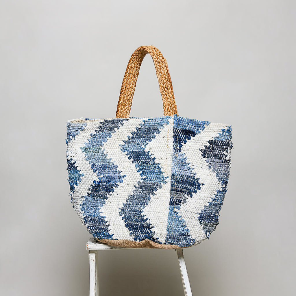 POL Clothing Denim Multi handwoven tote bag, side view showing blue and white chevron woven texture and braided handles
