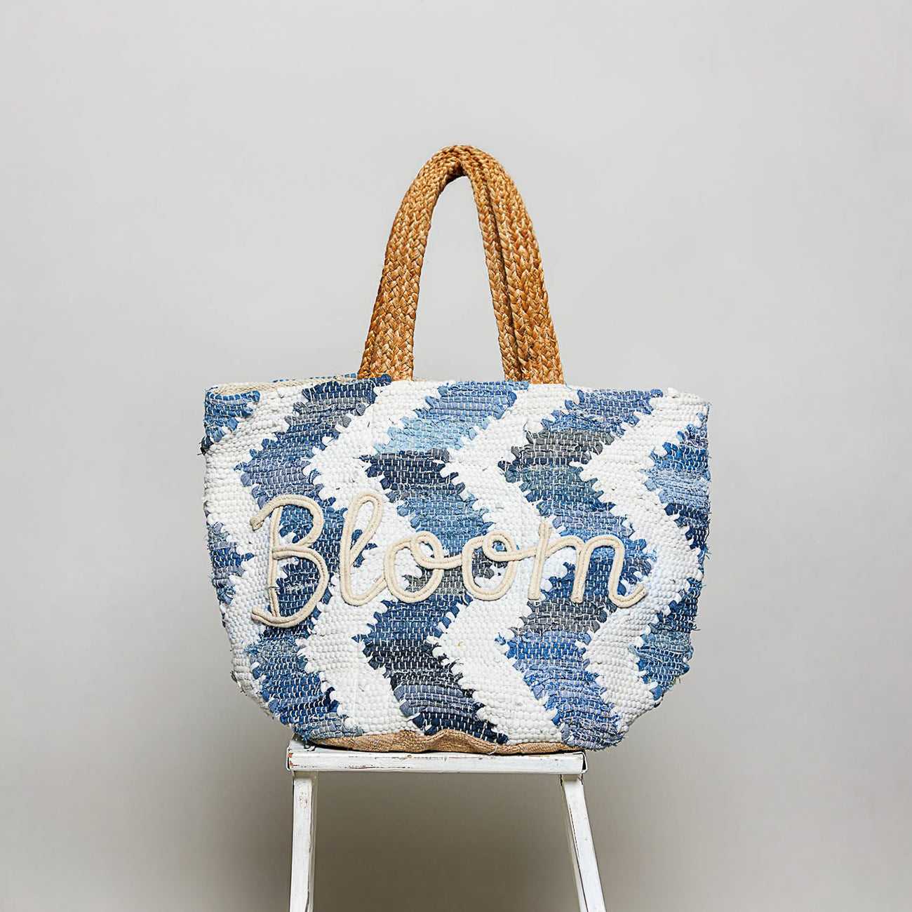 POL Clothing Denim Multi BLOOM handwoven tote bag, front view with raised rope lettering, braided handles - BellanBlue
