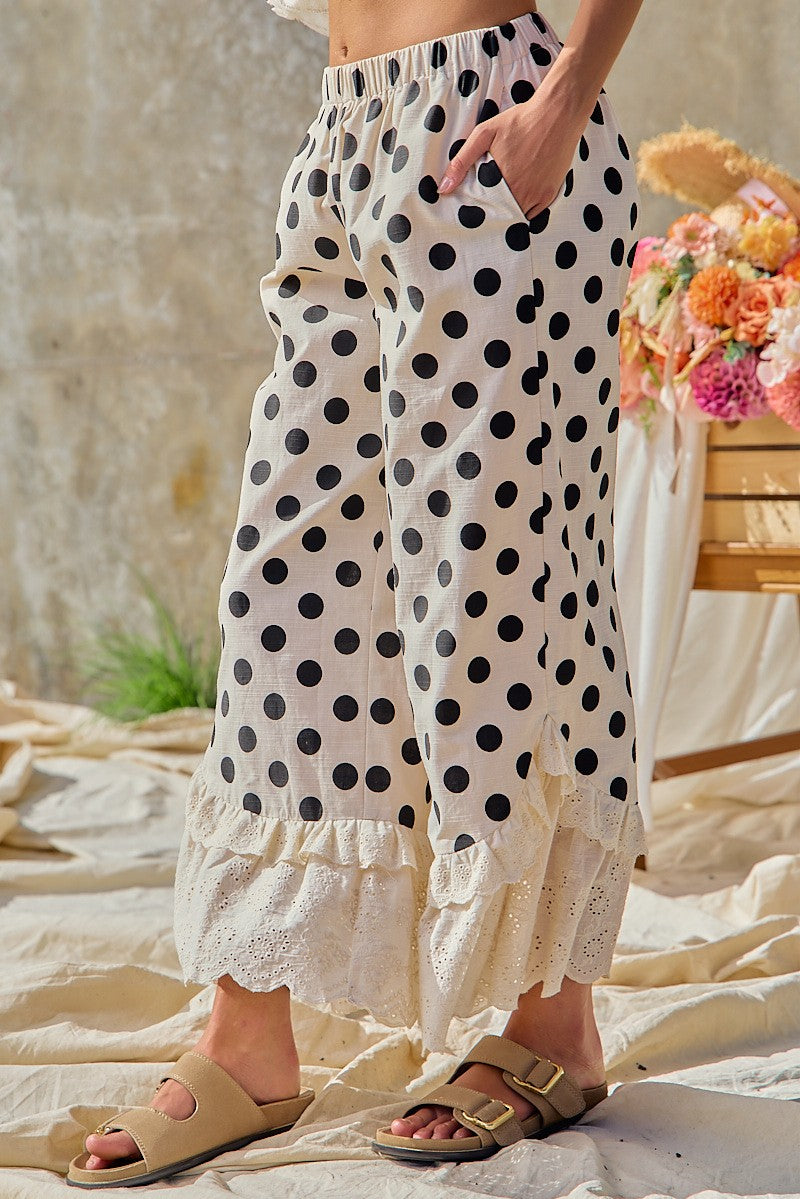 BiBi women's cream black polka dot wide leg pants with pocket detail and eyelet lace hem, side view
