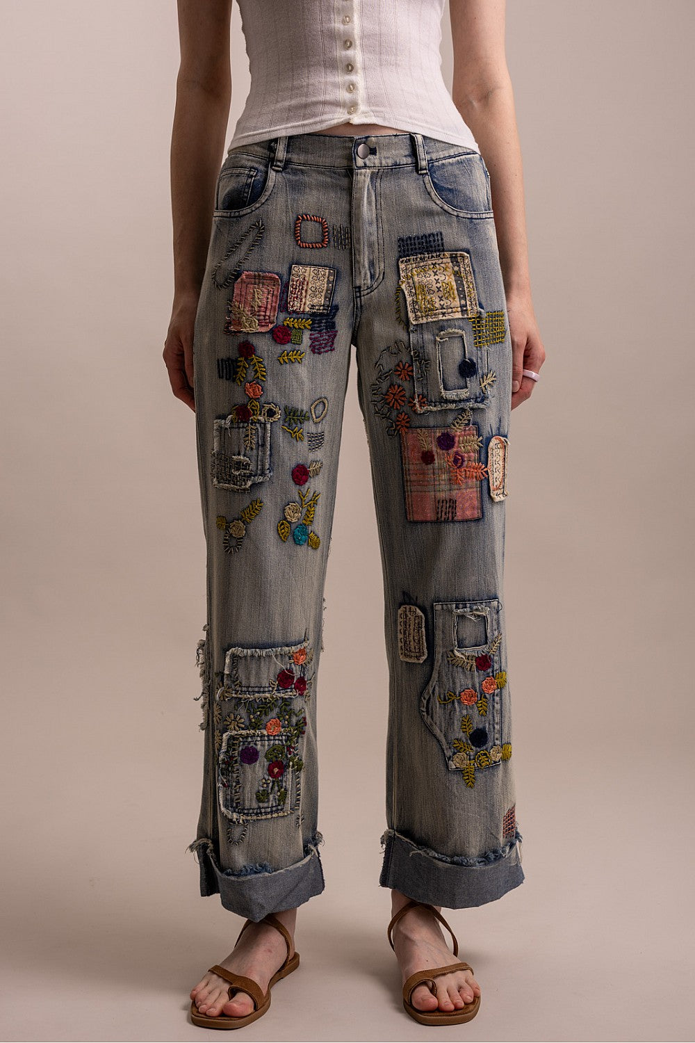 Blue Velvet patchwork embroidered wide-leg denim pants on model, full-length front view with cuffed hem
