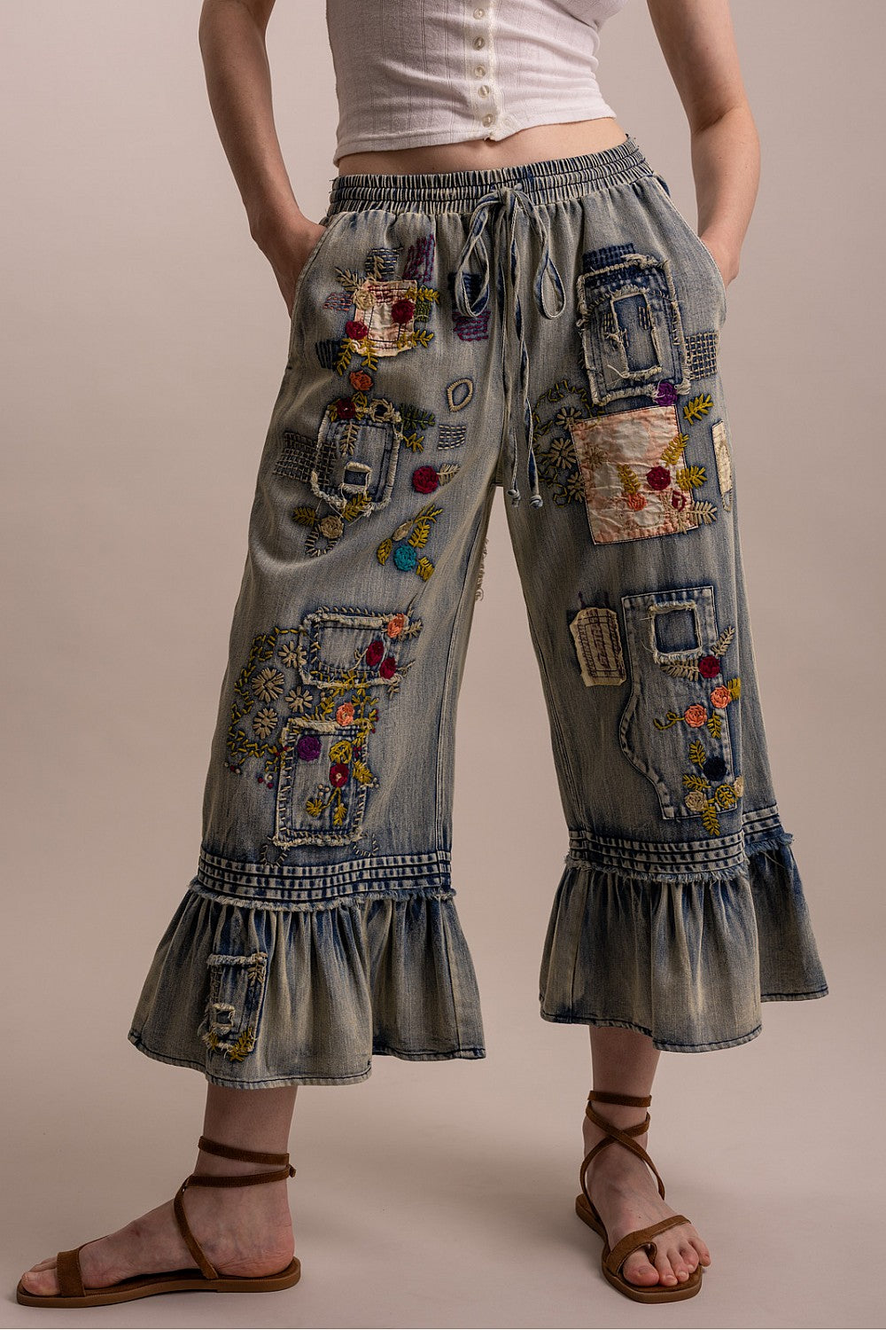 Blue Velvet women's denim patchwork pants showing gathered ruffle hems and embroidery, supplier view 4