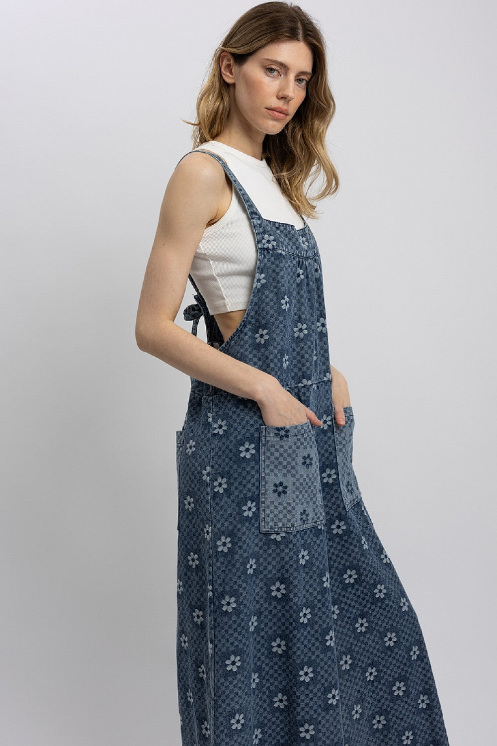 Blue Velvet Women's Blue Floral Chambray Denim Wide-Leg Jumpsuit showing side silhouette and flowy wide-leg drape.