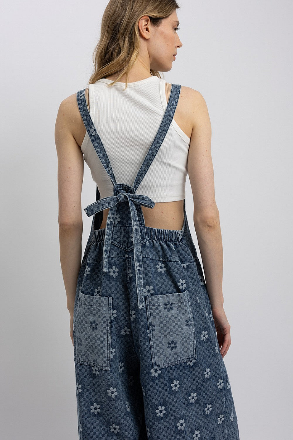 Blue Velvet Women's Floral Chambray Denim Wide-Leg Jumpsuit close-up highlighting square neckline and tie-back straps.
