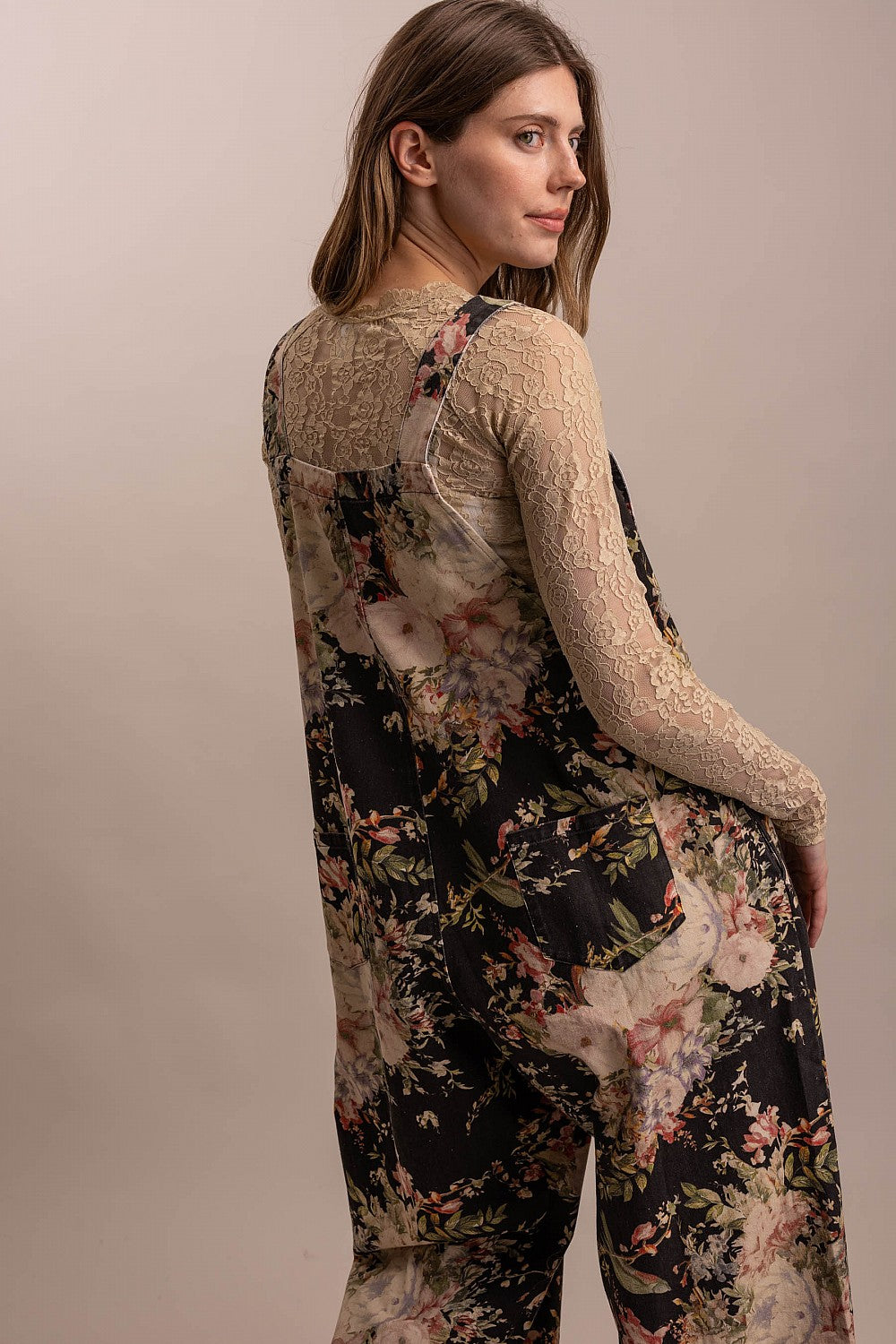 Bluevelvet black floral wide-leg overalls full-length front view, bib and button placket detail
