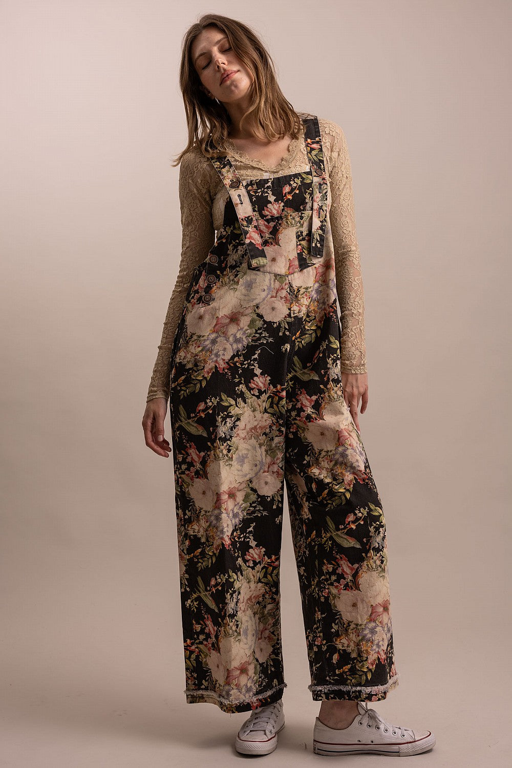 Bluevelvet black floral overalls upper body three-quarter view, bib placket and strap detail
