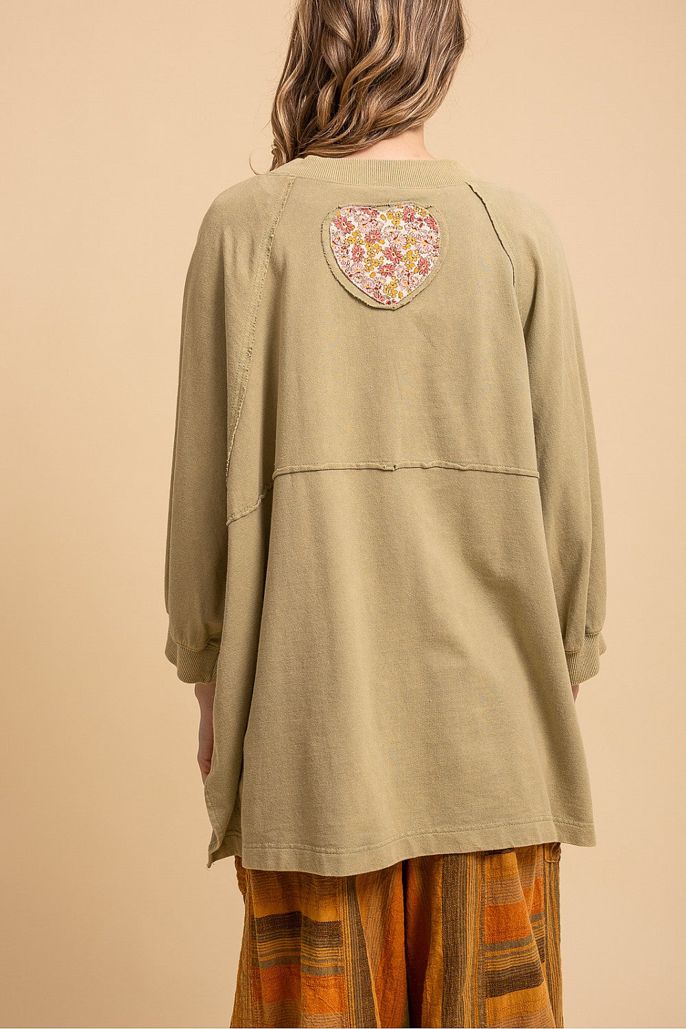 Blue Velvet sage heart patchwork sweatshirt, back view showing the floral heart patch and raw-edge seams
