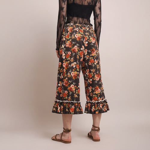 Bluevelvet women's floral capri pants back view, elastic waistband and gathered ruffle hem detail
