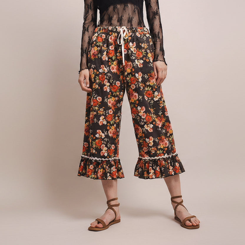 Bluevelvet women's wide-leg floral capri pants front view, full silhouette and ruffle hem on model
