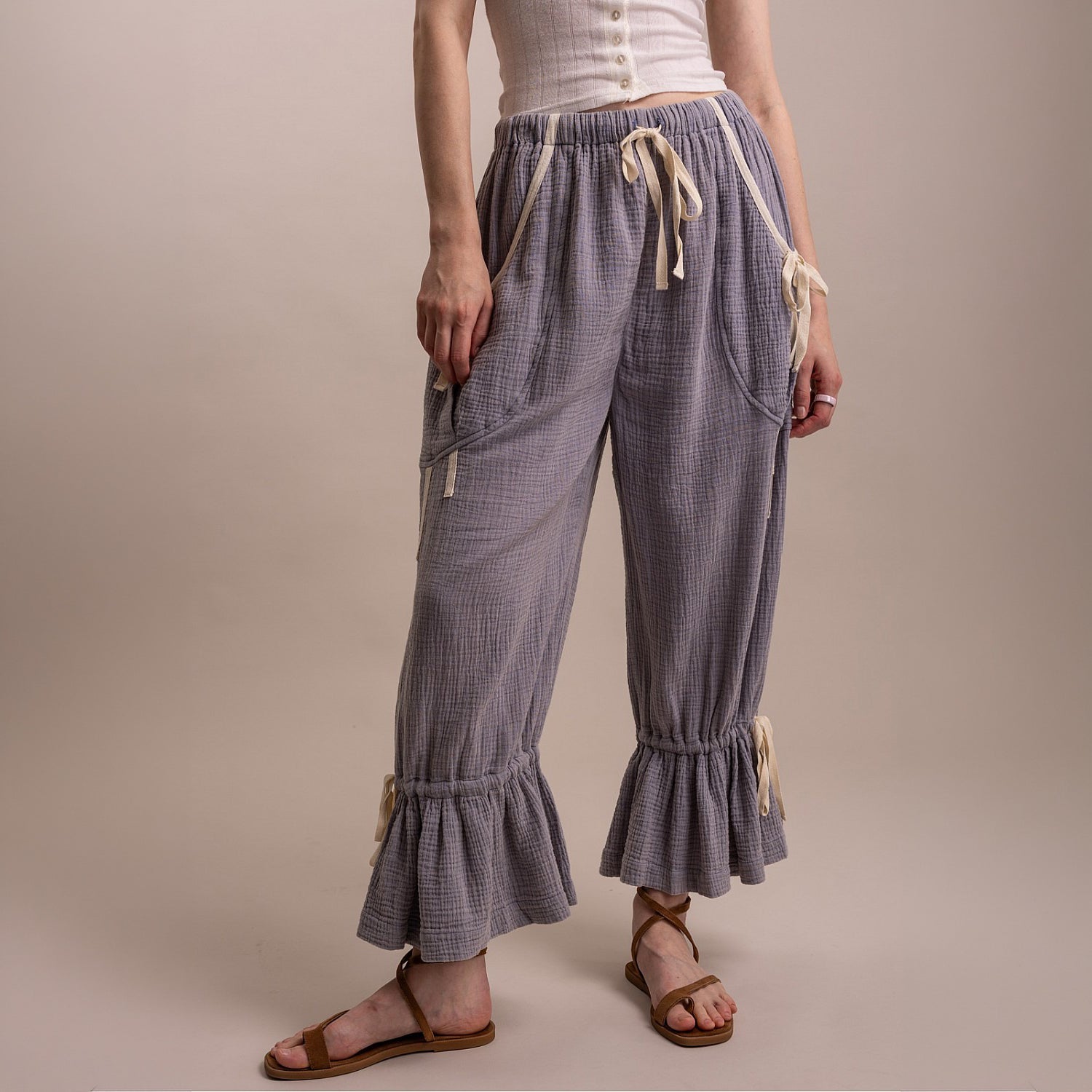 Bluevelvet women's denim blue bloomer pants, front view showing bow tie waist, cargo pockets, and ruffle hem
