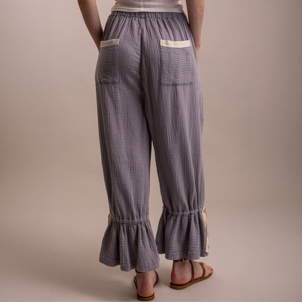 Blue Velvet women's denim blue bloomer pants, back view showing back pockets, crinkle texture, and ruffle hem
