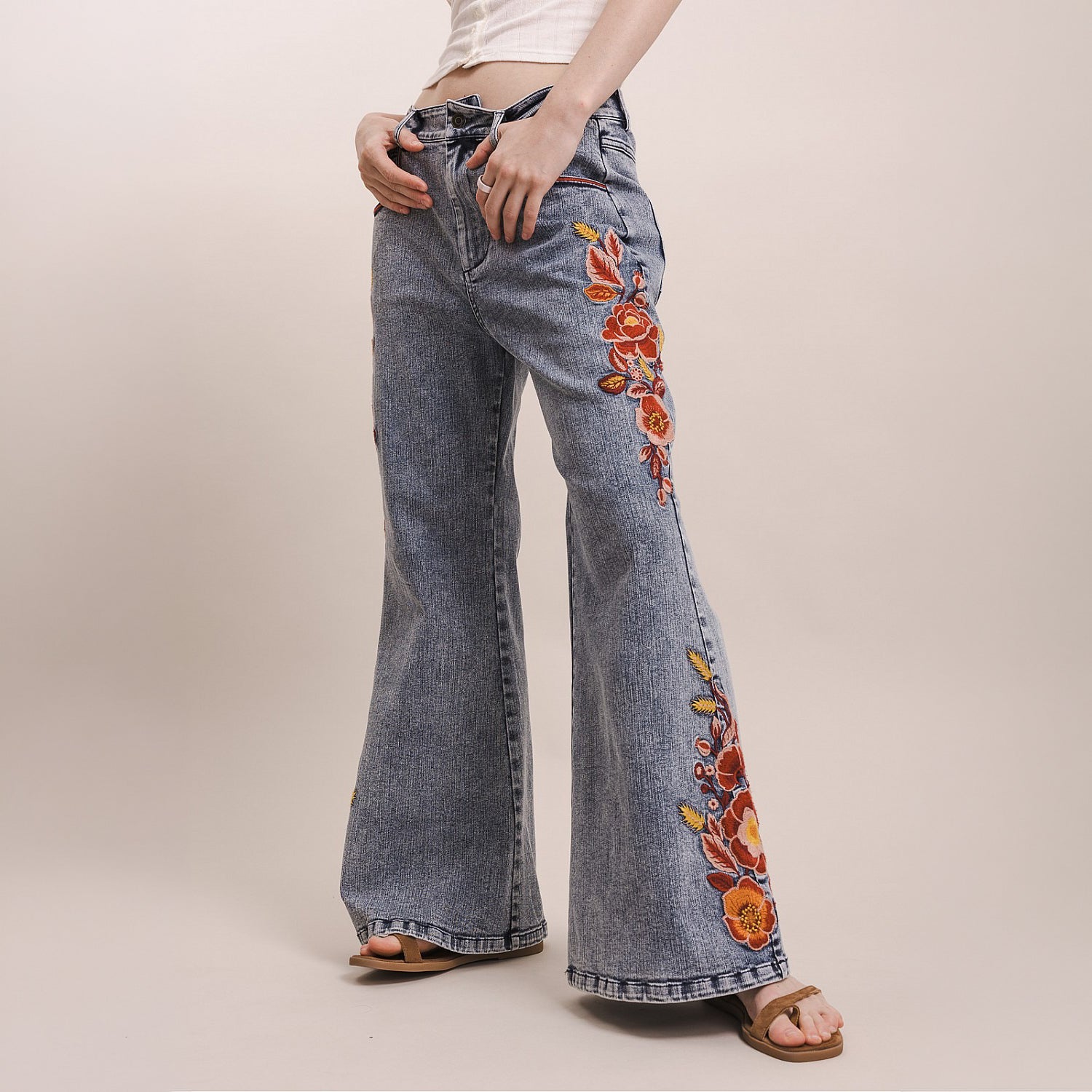 Bluevelvet women's denim wide-leg flare pants, front three-quarter view with floral embroidery
