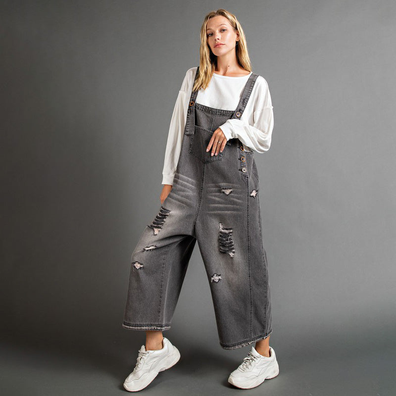 Ladies' Sanforized Washed Denim Dungarees, an outsize shape for sluggish, leisurely lounging, with adjustable button straps and distressed decor. 