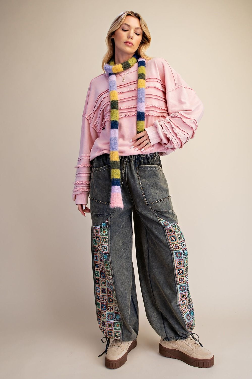 Easel Clothing dirty denim wide-leg jogger pants with crochet patchwork side panels, full-length front view on model
