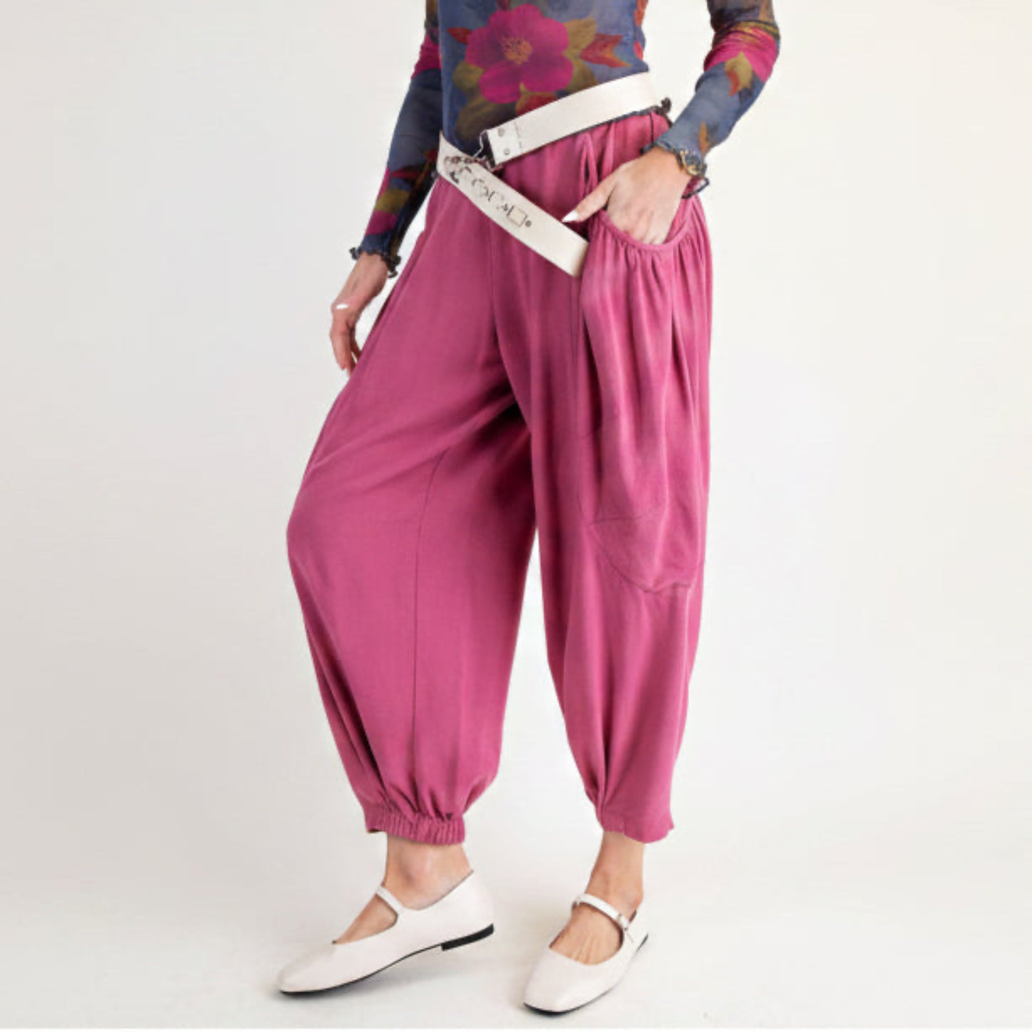 Easel women's rose pink harem pants three-quarter view styled with white crossbody belt
