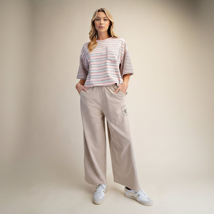 Easel khaki mineral wash wide-leg pants full outfit, smocked waistband and flower embroidery patch on side
