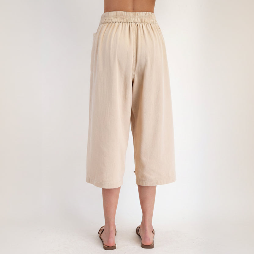 Easel women's khaki twill capri pants back view showing smocked elastic waistband and wide leg
