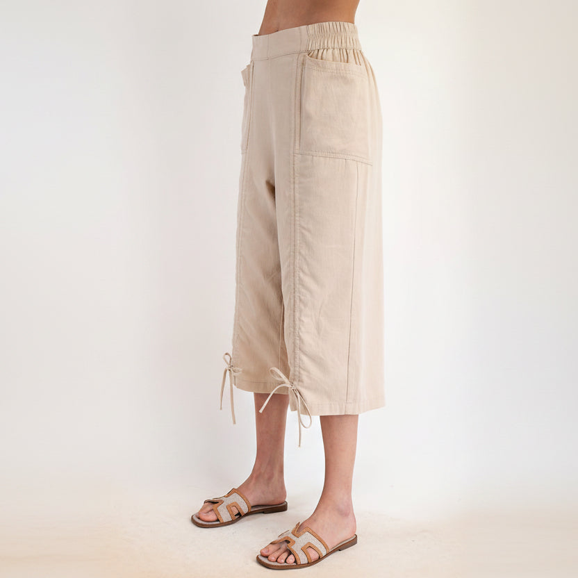 Easel women's khaki capri pants side view showing front patch pocket and adjustable drawstring hem
