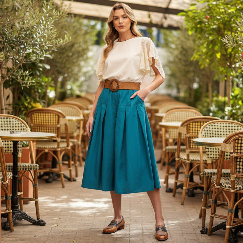 Easel women's teal pleated midi skirt with elastic waist and side pockets, full-length model view - BellanBlue
