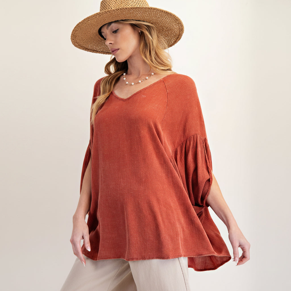 Easel brick mineral washed top, front close-up showing V-neck, raglan seam, and gathered sleeve detail
