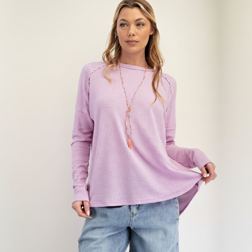 Easel lavender pink thermal knit pullover, relaxed fit, curved hem detail, waffle texture close-up
