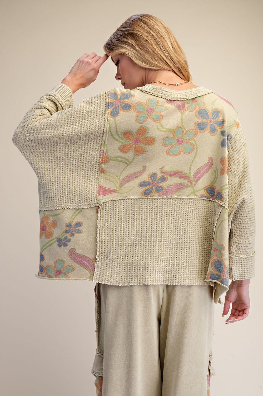 Easel women's sage floral panel top, dolman sleeves in motion, outdoor boutique lifestyle styling
