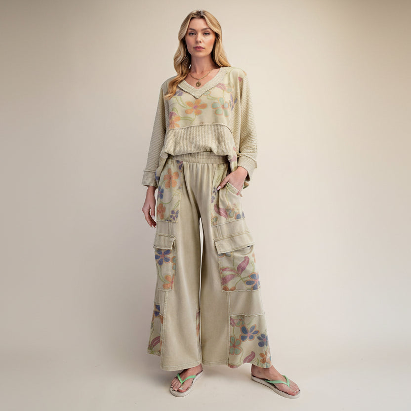 Easel women's dusty sage waffle knit floral top, seated pose showing back panel drape and cropped silhouette
