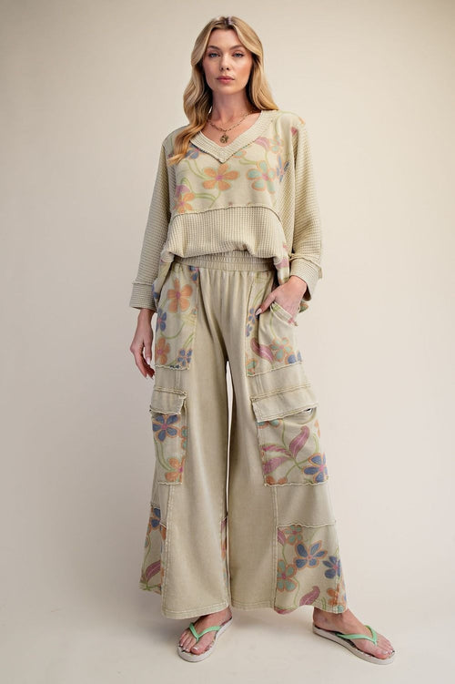 Easel women's dusty sage waffle knit floral top, seated pose showing back panel drape and cropped silhouette
