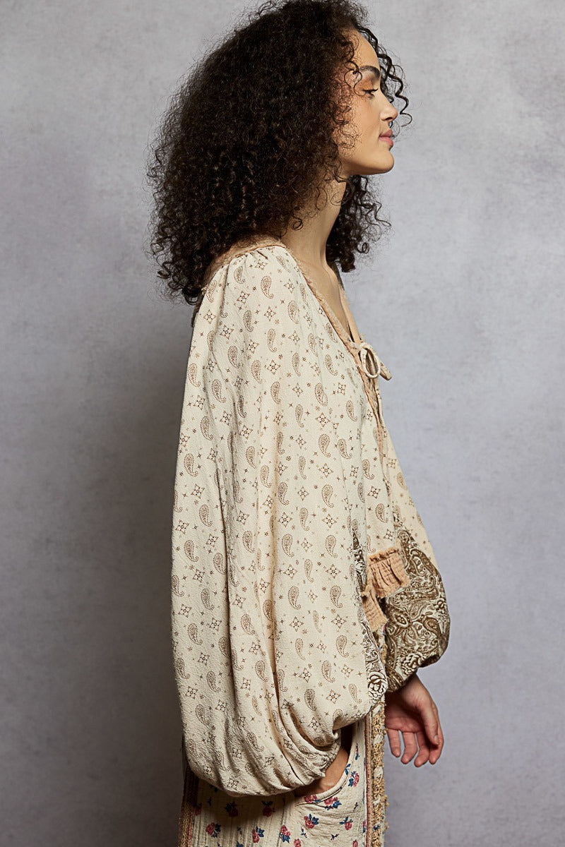 Woman wearing a floral dress with a plain background