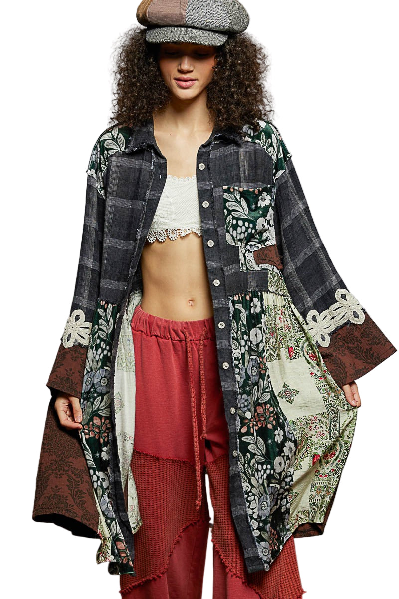 Person wearing a patterned coat over a red outfit with a white top, on a white background