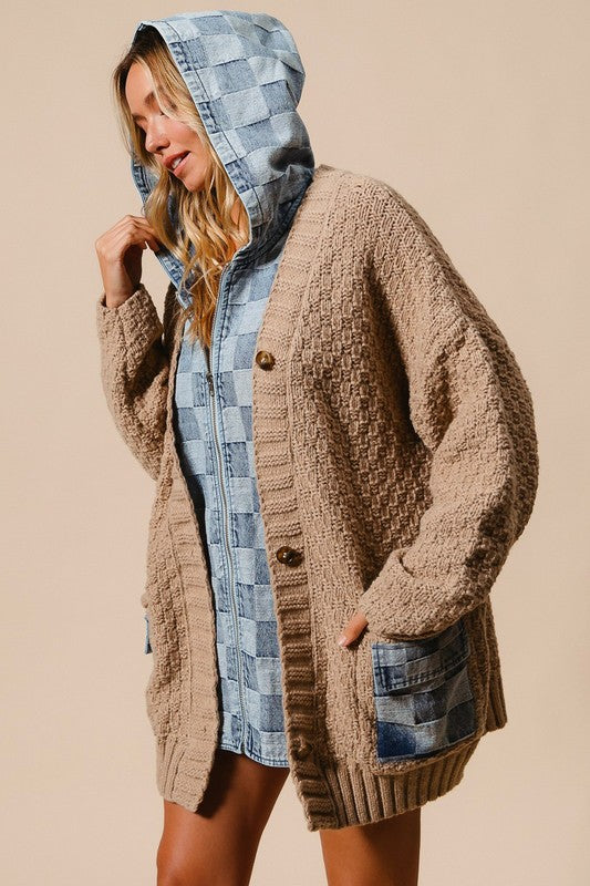 a woman wearing a hooded jacket and shorts
